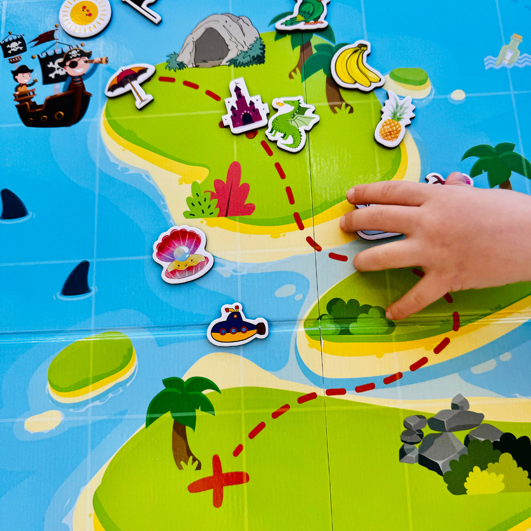 Child exploring a colorful pirate-themed learning mat with Arabic letters and vocabulary